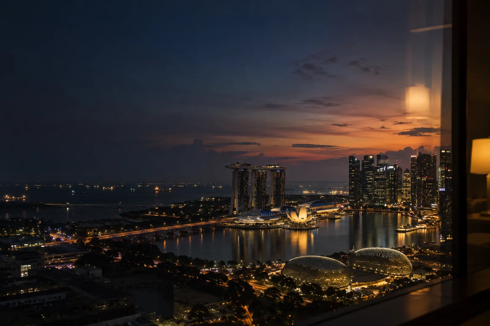 Singapore skyline at dusk from a high office window